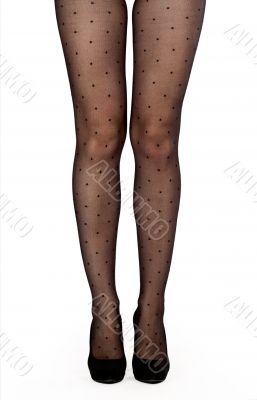 Beautiful female legs in pantyhose and shoes with heels