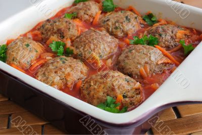Meatballs with herbs and tomato sauce in the pan