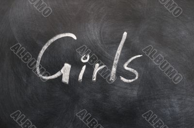 Girls - word written in white chalk