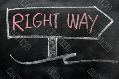 Signpost of right way drawn in chalk on a blackboard