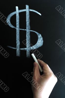 US dollar sign written on blackboard