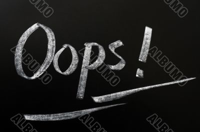 Oops written in chalk on a blackboard