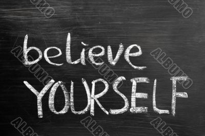 Believe yourself text written on blackboard