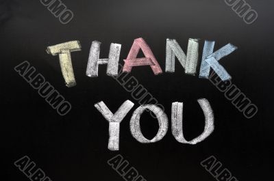 Thank you - text written with chalk on blackboard