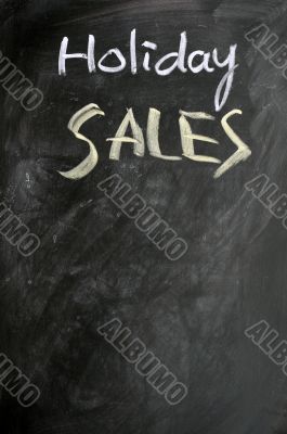 Holiday sales written on a blackboard