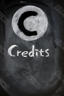 Credits sign on a blackboard