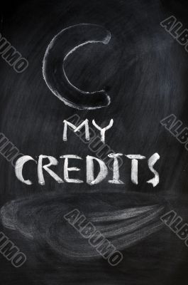 Credits sign on a blackboard