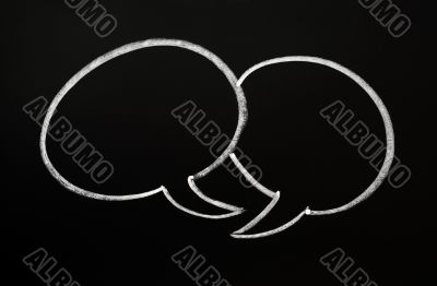Two speech bubbles on a blackboard