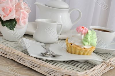 Cake with a cup of coffee on a tray