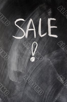 Sale written on blackboard