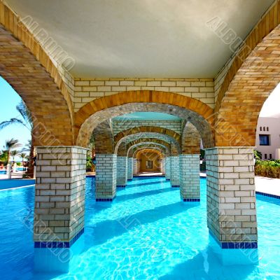  Swimming pool under bridge in resort
