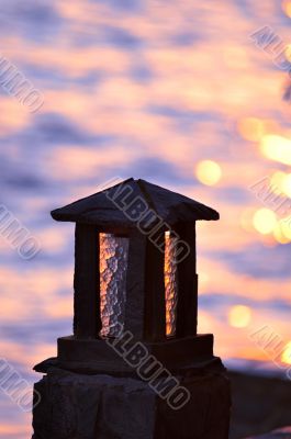 Stone lamp at seashore