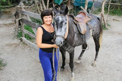 Portrait happy smiling woman with horse