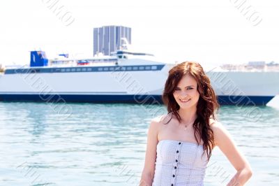 The girl on the background of the ocean liner