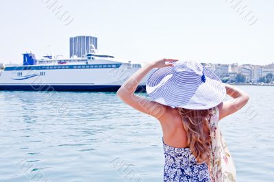 The girl on the background of the ocean liner