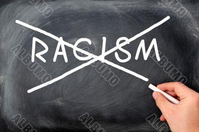 Crossing out racism on a blackboard