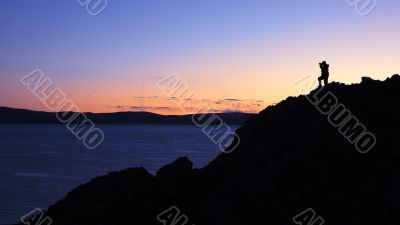 Landscape in Tibet with a photographer`s silhouette