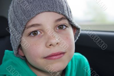 closeup of cute young teen boy in gray hat