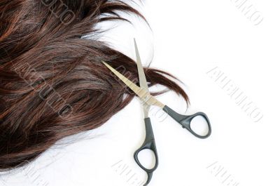 Brown hair and scissors
