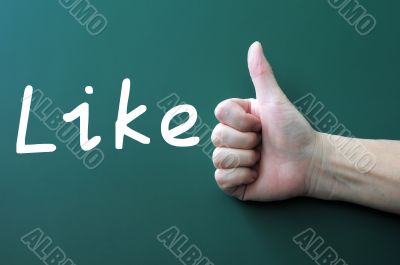 Thumb up on a blackboard with the word Like