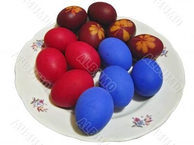 Easter eggs on the white plate isolated on the white background