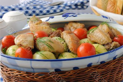 Baked potatoes with chicken and tomato