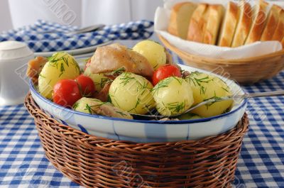 Baked potatoes with chicken and tomato