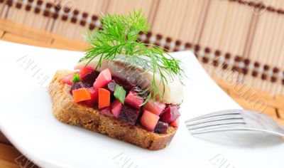 Sandwiches with rye bread, herring and vegetables