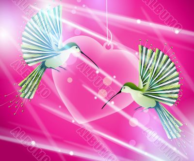  hummingbirds flying around pink heart