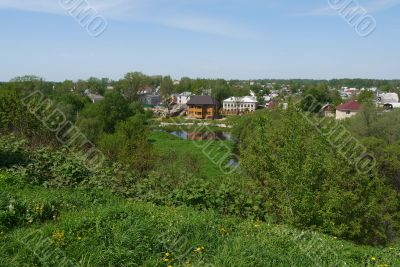 Houses in a green valley