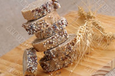 A stack of slices of bread with grains