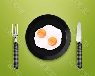 Two fried eggs on a Plate