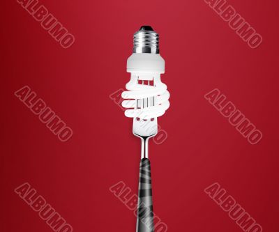 light bulb pierced by fork