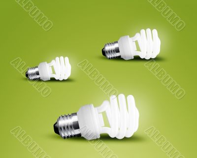Three glowing Light bulb idea on green background