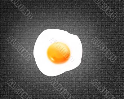 Fried egg on black background