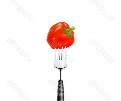 Red pepper pierced by fork,  isolated on white background 
