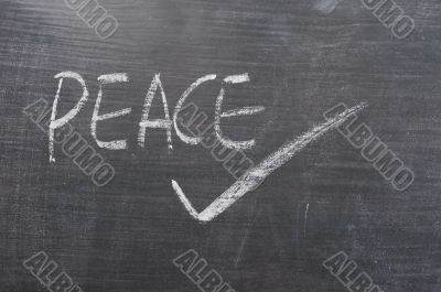 Peace - word written on a blackboard