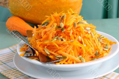 Salad of pumpkin and carrot with pumpkin seeds