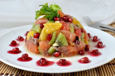 Fruit salad with salmon and pomegranate