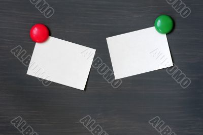Blank stick note on a blackboard