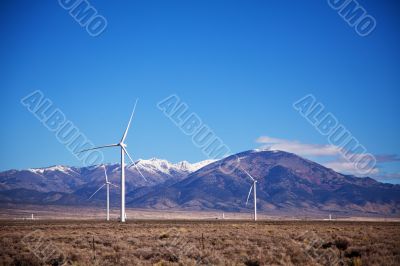 Power mills field in front of the mountain range