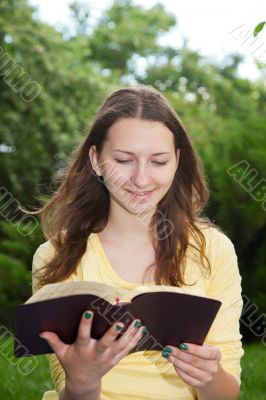 Teen girl reading book
