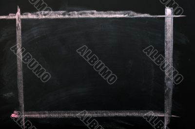 Chalkboard background with a chalk drawing frame