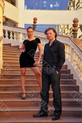 couple standing on the stairs at the hotel