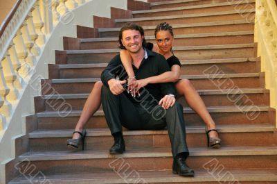 Couple sitting on steps