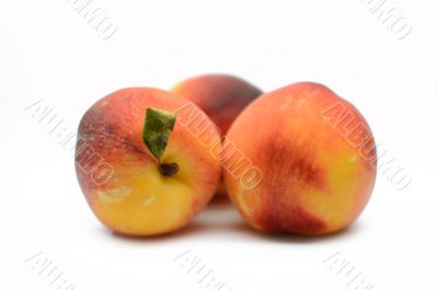 Juicy peaches on a white background
