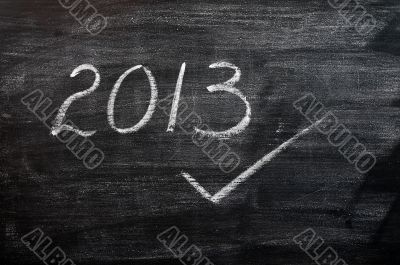 2013 written with chalk on a smudged blackboard