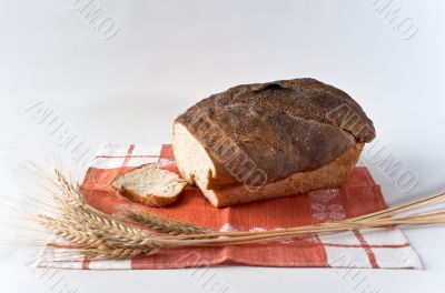 Loaf and slice of wheat bread 