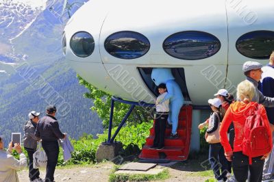 Alien stealing a little boy near the UFO