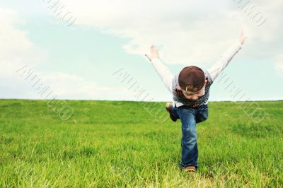Young boy playing in a field